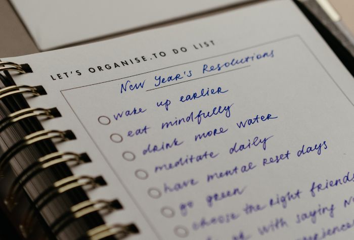 new year resolutions to-do list written in notebook